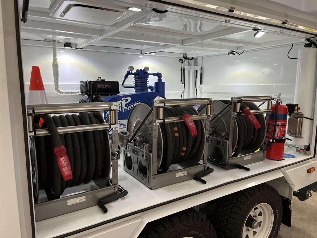 Trailer internal hose reels